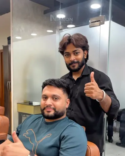 Client with a fresh fade and groomed beard with his barber at N Salon Pitampura