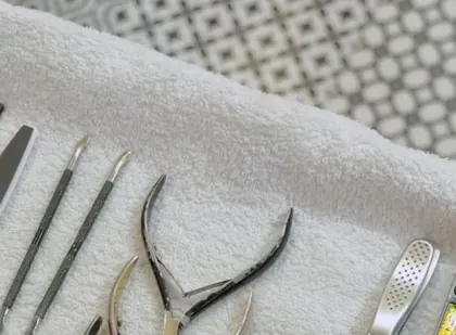 Pedicure tools laid out on a towel at N Salon Pitampura
